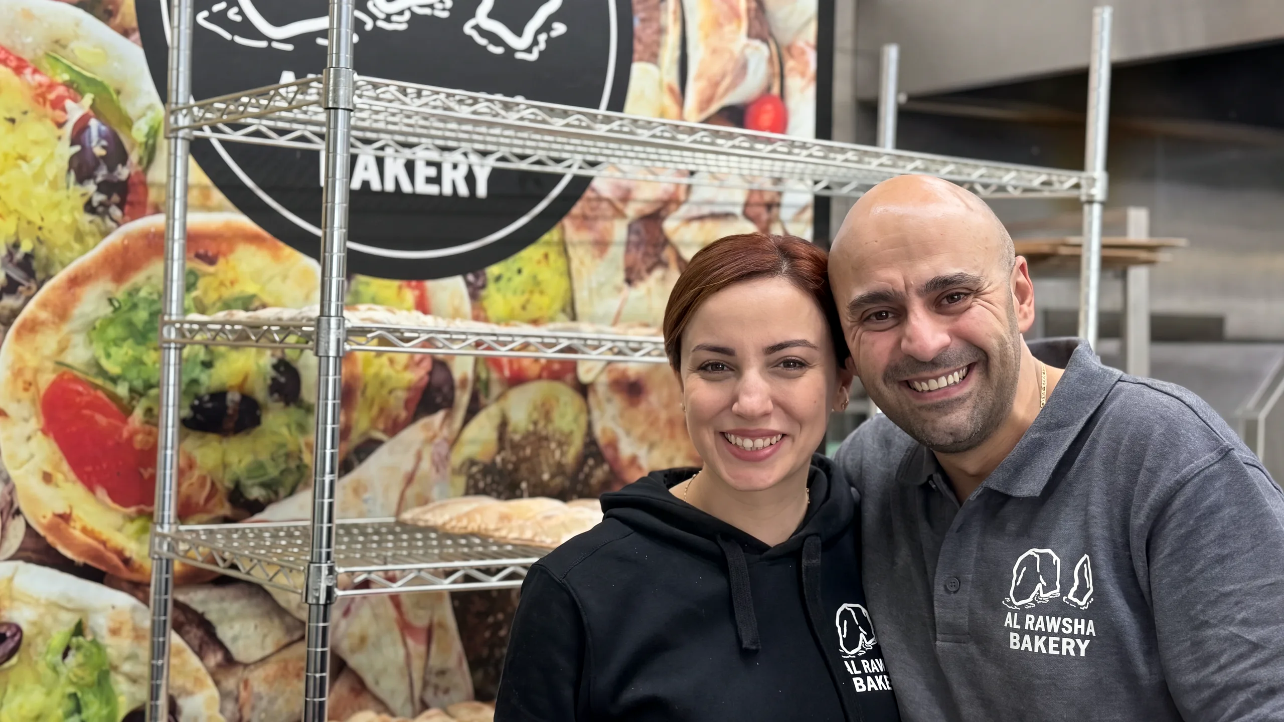 Rima and George in their bakery